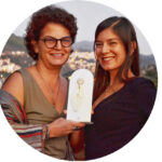 owners of Seafront Homes Kaş holding an Airbnb Superhost award at the Studio Home